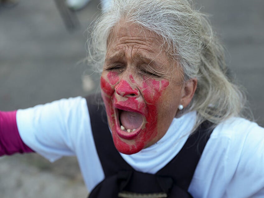 A woman screams during a vigil held by relatives of detainees calling for the freedom of p