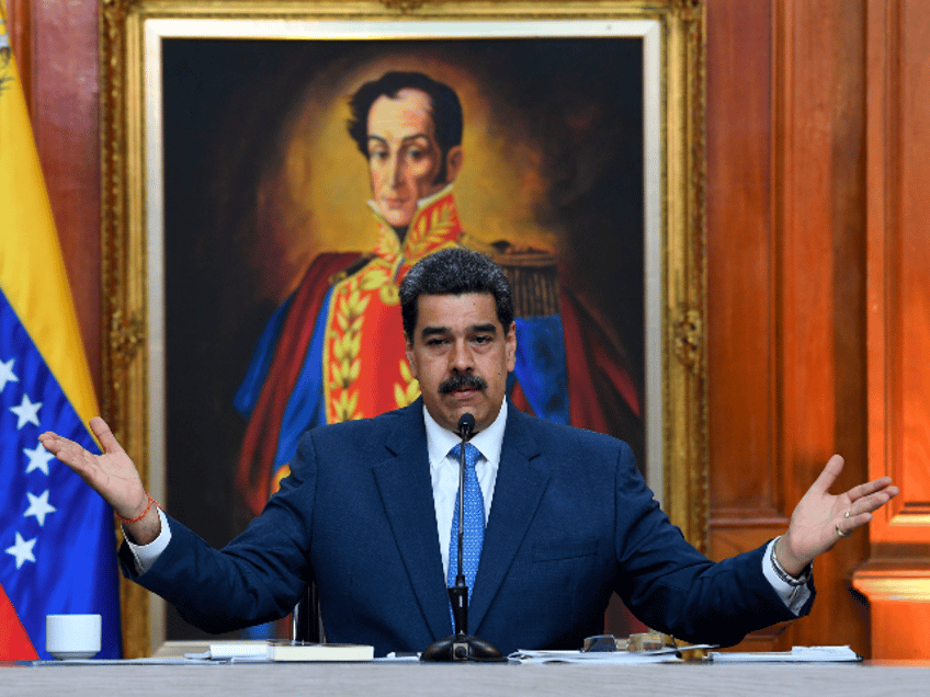 Venezuela's President Nicolas Maduro gestures during a press conference with members of th