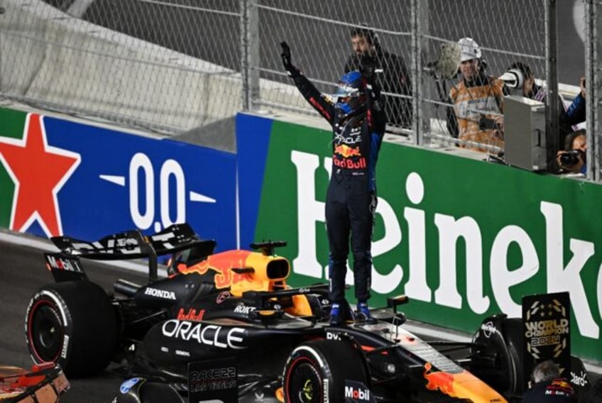 Red Bull Racing's Max Verstappen celebrates winning his fourth consecutive Formula One wor