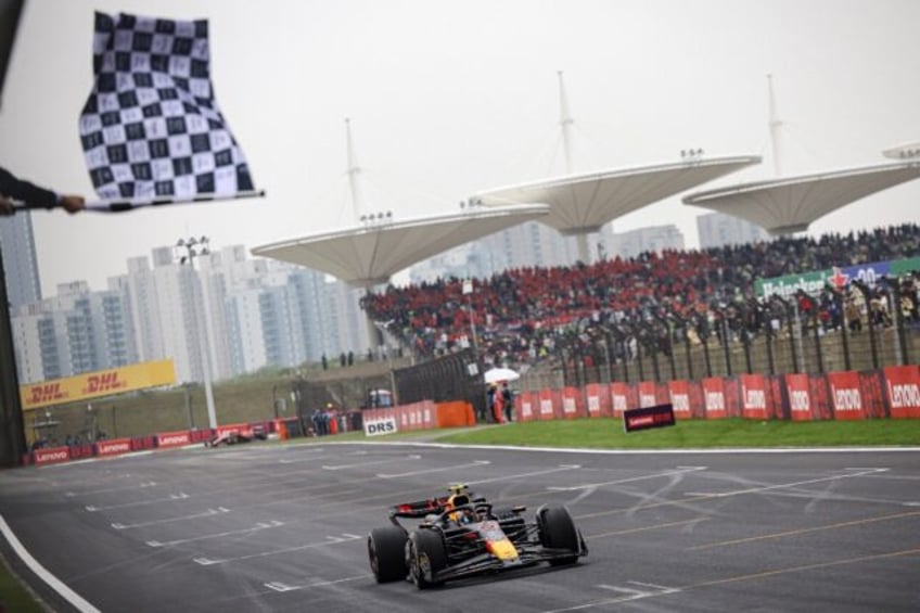 Max Verstappen takes the chequered flag to win the Chinese Grand Prix