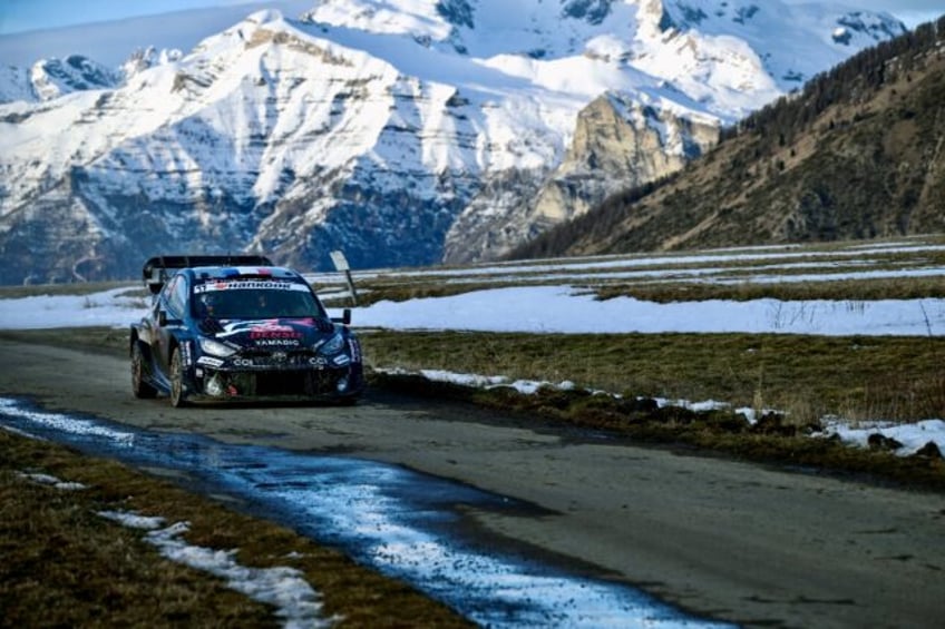 Toyota's French driver Sebastien Ogier leads the way in the Monte Carlo Rally not far from