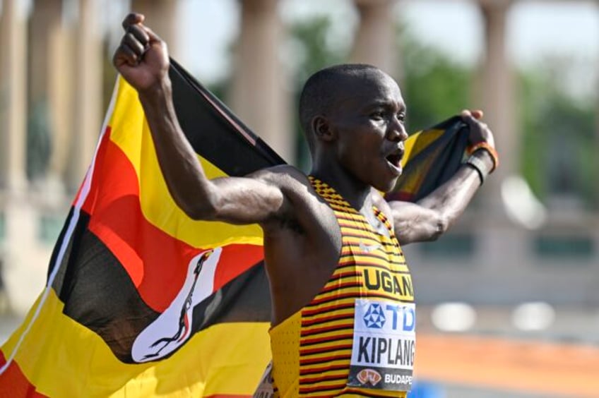 victor kiplangat of uganda pulls away late to win mens marathon on last day at worlds