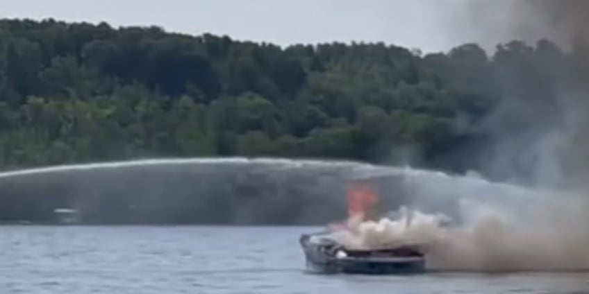 video captures michigan boaters diving into water before boat is engulfed in flames