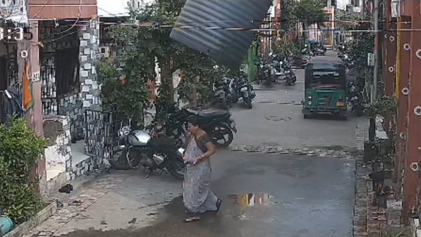 Water tank falls on woman