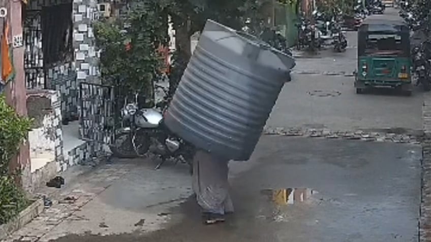 Water tank falls from building in Surat, India.