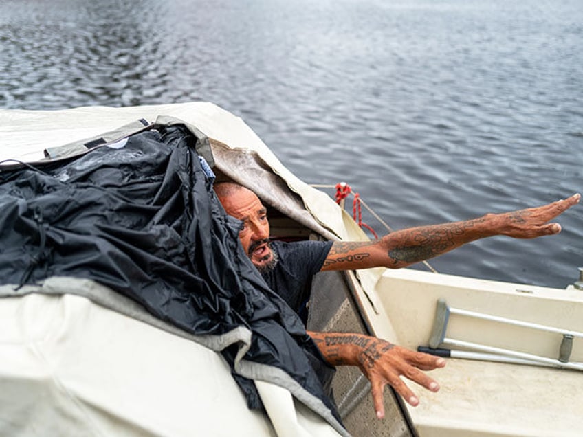 Tampa police try to persuade a local resident who is living on his boat known as Jay and n