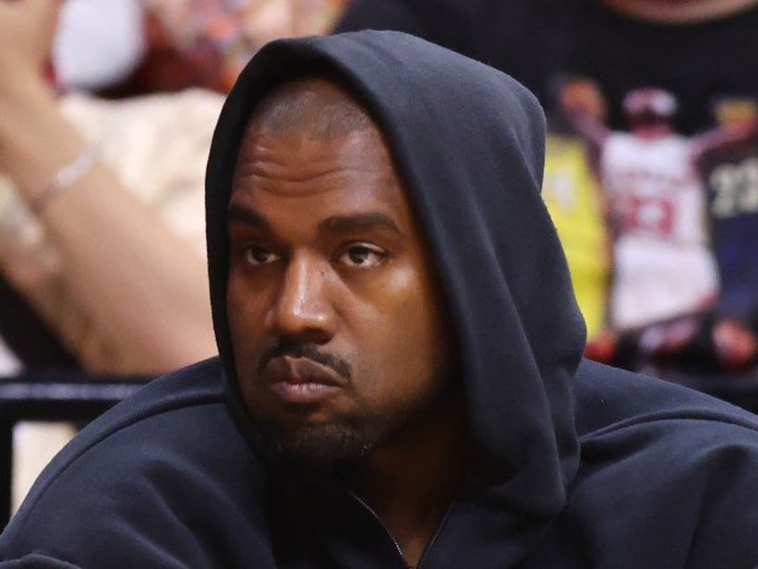 Rapper Kanye West looks on courtside during the first half between the Miami Heat and the Minnesota Timberwolves at FTX Arena on March 12, 2022 in Miami, Florida. NOTE TO USER: User expressly acknowledges and agrees that, by downloading and or using this photograph, User is consenting to the terms …