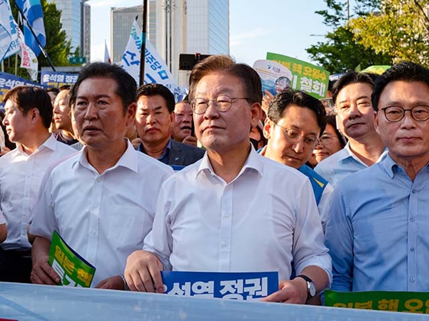 video man in paper crown stabs south korean opposition leader in neck at political event