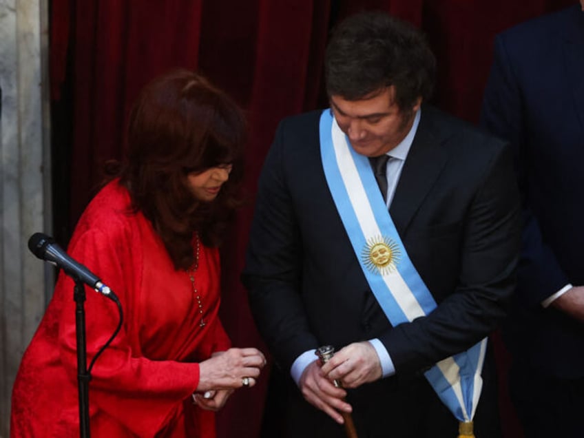 Argentina's new President Javier Milei (R) listens to outgoing Vice-President Cristina Fernandez de Kirchner after being sworn in during his inauguration ceremony at the Congress, in Buenos Aires on December 10, 2023. Libertarian economist Javier Milei was sworn in Sunday as Argentina's president, after a resounding election victory fueled by fury over the country's economic crisis. "I swear to God and country... to carry out with loyalty and patriotism the position of President of the Argentine Nation," he said as he took the oath of office, before outgoing President Alberto Fernandez placed the presidental sash over his shoulders. (Photo by ALEJANDRO PAGNI / AFP) (Photo by ALEJANDRO PAGNI/AFP via Getty Images)