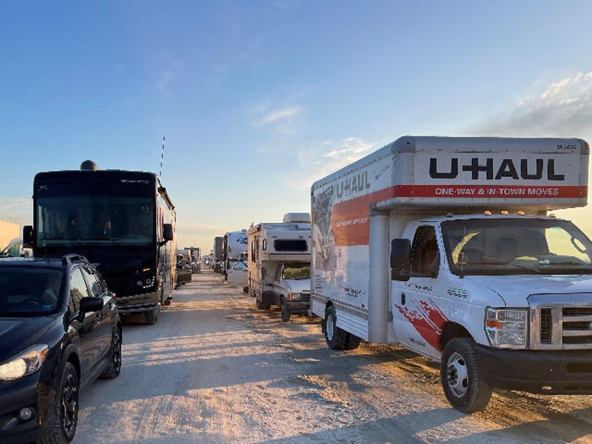 video revelers drive six miles in 9 hours to flee anti capitalist burning man festival as tens of thousands languish