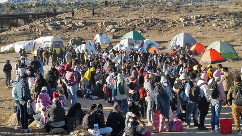 Migrants waiting to cross into the US