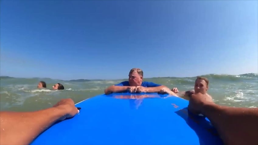 video shows moment us marine saves jersey shore swimmer from deadly rip current