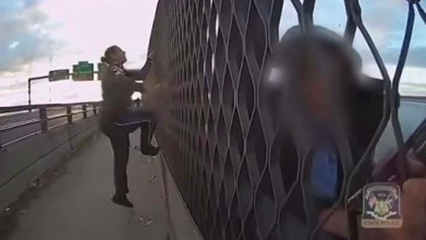 video shows moments connecticut police officers rescue woman from jumping off 100 foot bridge