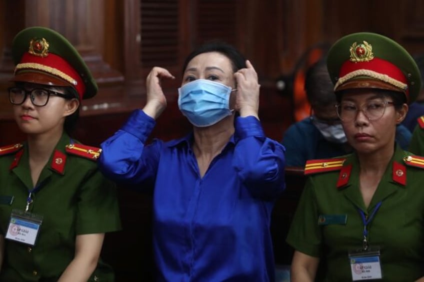 Vietnamese property tycoon Truong My Lan (C) looks on at a court in Ho Chi Minh city on Se