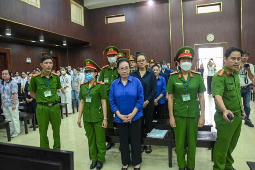 Vietnamese property tycoon Truong My Lan (C) -- jailed for life for money laundering -- wi