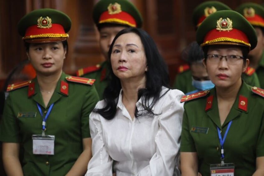 Vietnamese property tycoon Truong My Lan (C) looks on at a court in Ho Chi Minh City on Th