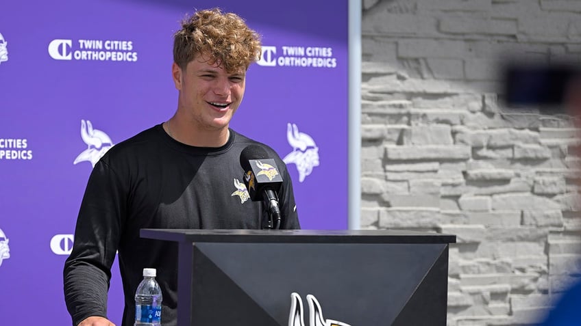 J.J. McCarthy talks to the media