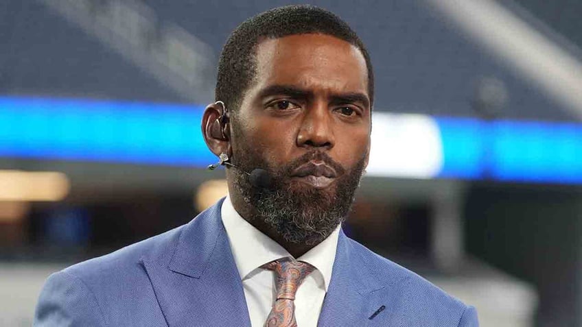 Randy Moss looks on