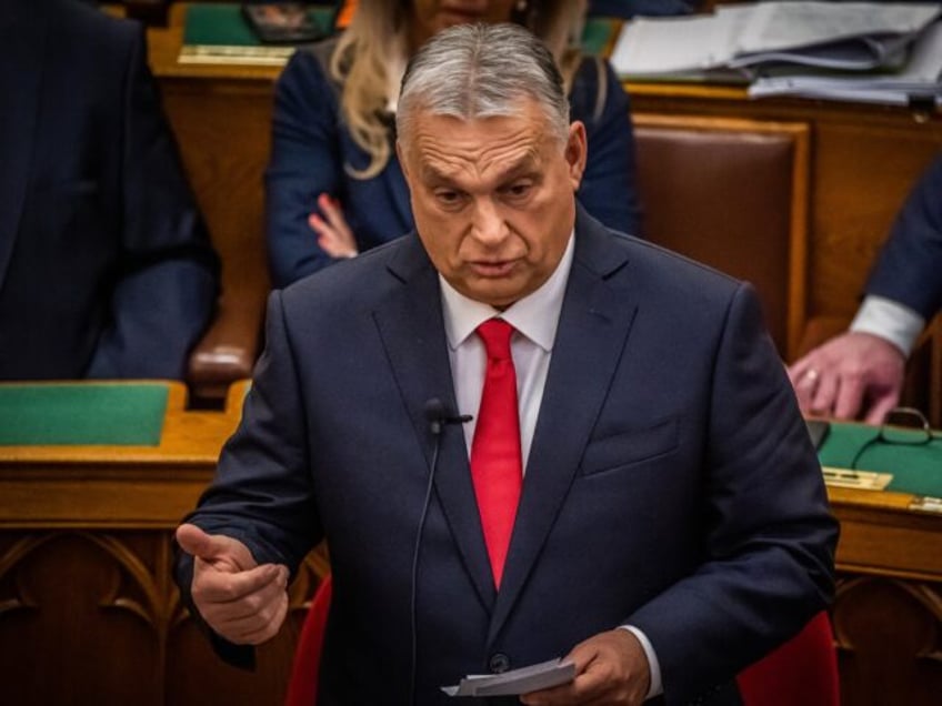 Hungarian Prime Minister Viktor Orban answers questions after he delivered a speech in the