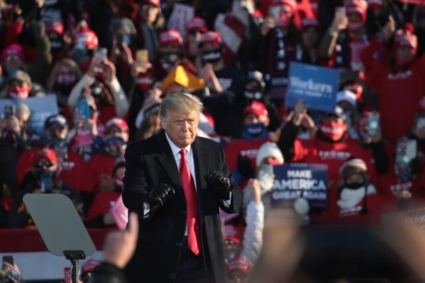 Donald Trump, shown here dancing to a Village People song as he wraps up a campaign rally