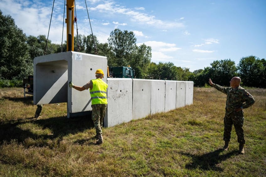 villagers in nato territory get bomb shelters to protect from russian drone attack debris