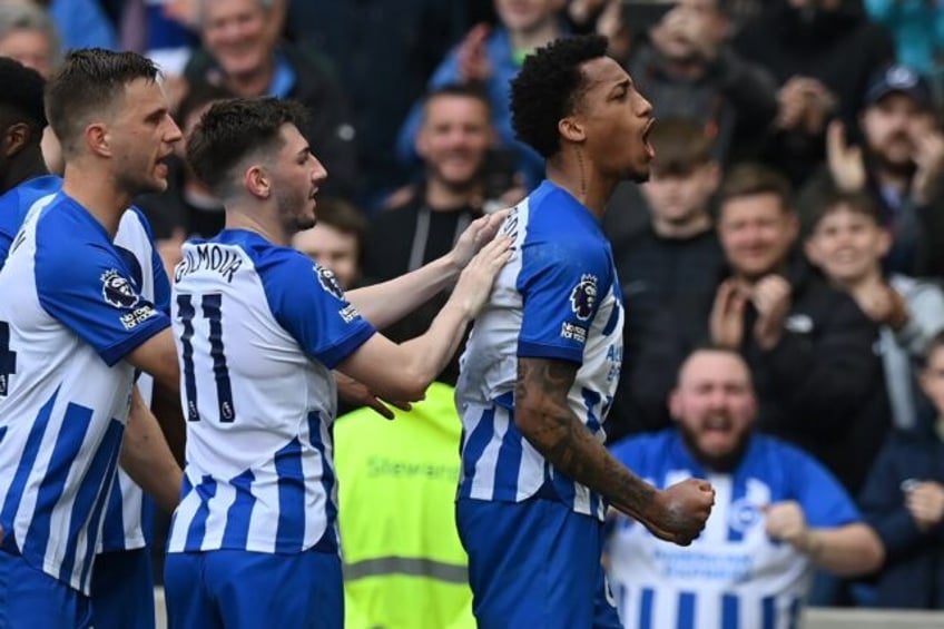 Brighton's Joao Pedro (R) celebrates after scoring against Aston Villa