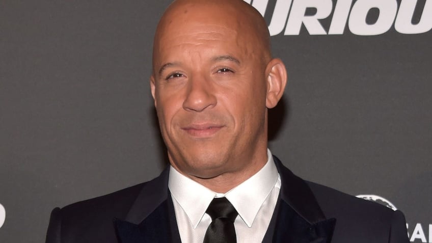 Vin Diesel wears suit and tie on red carpet