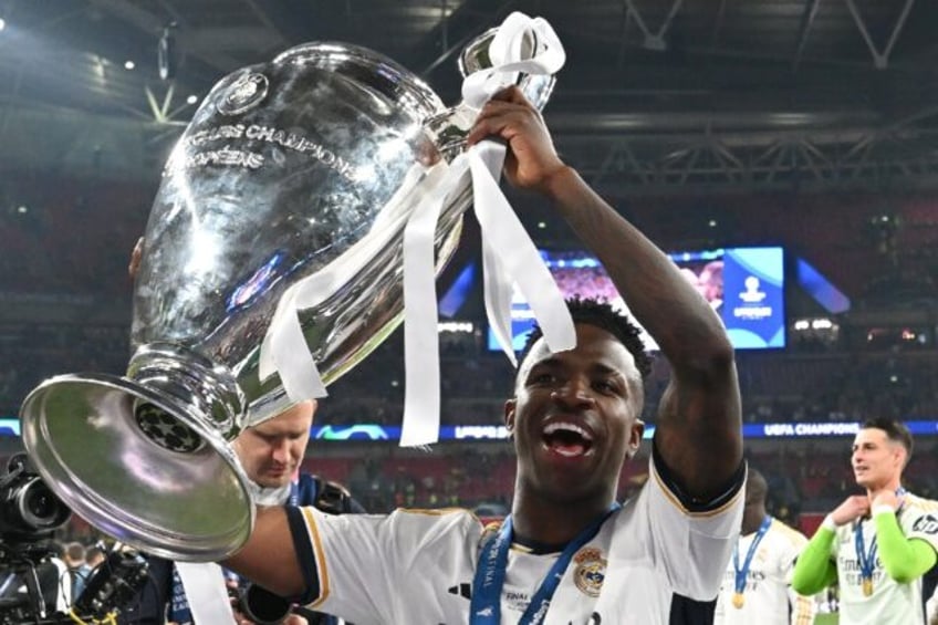 Real Madrid's Vinicius Junior lifts the Champions League trophy