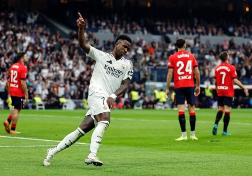 Real Madrid's Brazilian forward Vinicius Junior celebrates scoring his team's first goal i