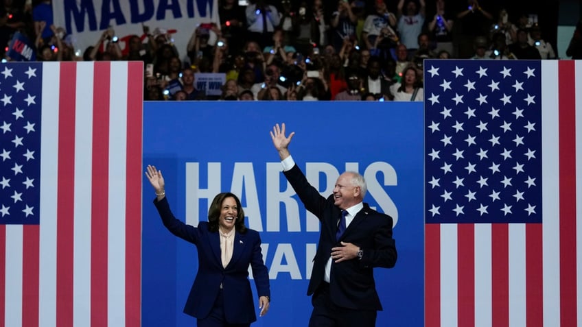 Vice President Harris with Gov. Walz waving from stage to rally attendees