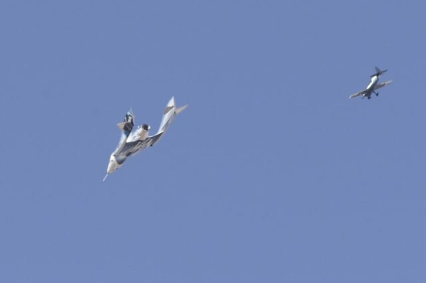 The Virgin Galactic SpaceShipTwo spaceplane Unity and mothership separate as they fly way