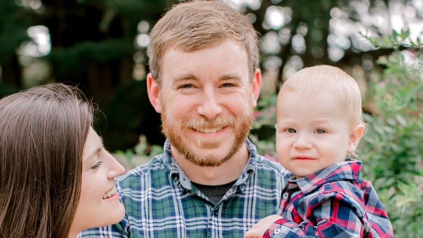 Tyler Wenrich, his wife and their toddler