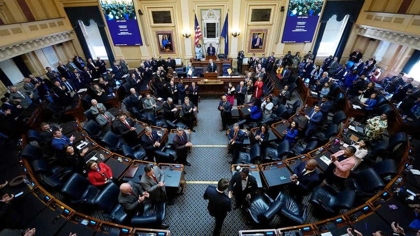 Virginia Gov. Glenn Youngkin arrives in the House chambers to deliver his State of the Commonwealth address