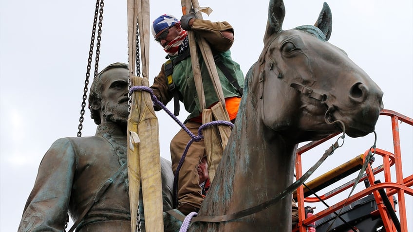 A crew removes the statue of Confederate Gen. Stonewall Jackson