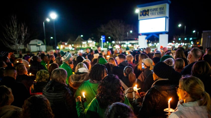 Residents of Newport News hold a candlelight vigil