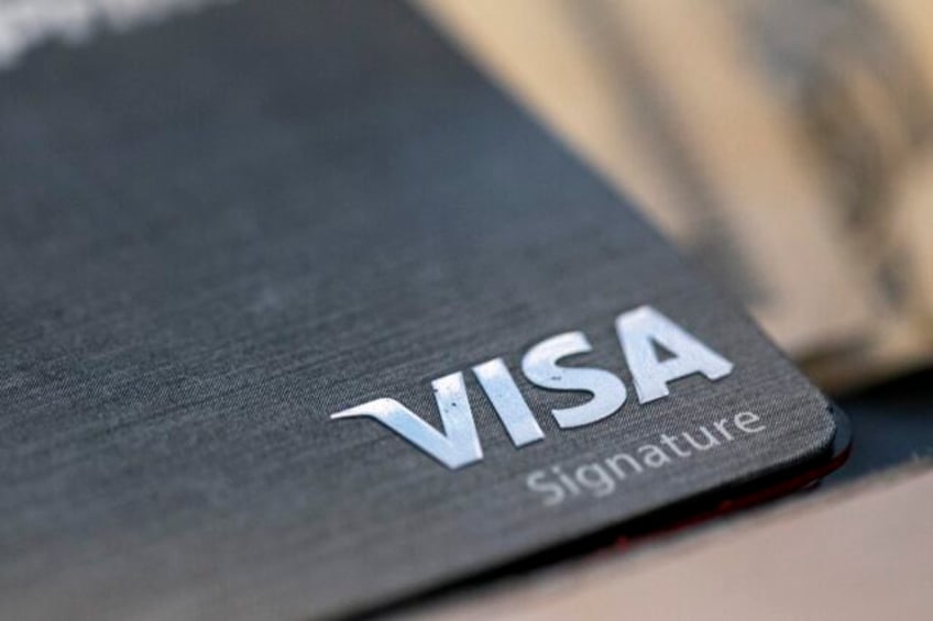 visa profits rise as global customers increasingly use credit and debit cards instead of cash