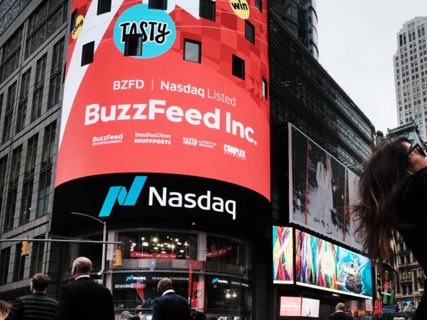 NEW YORK, NEW YORK - DECEMBER 06: BuzzFeed is displayed in front of the Nasdaq market site as the media company goes public on the Nasdaq through a merger with a special-purpose acquisition company on December 06, 2021 in New York City. Shares of the digital media company, trading under the new ticker “BZFD,” rose 12.7% to $10.84 as markets opened Monday. (Photo by Spencer Platt/Getty Images)