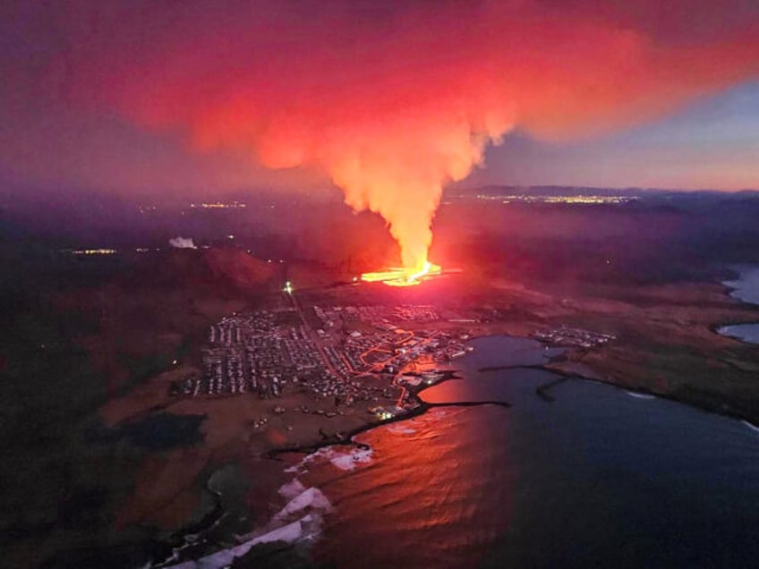 TOPSHOT - Billowing smoke and flowing lava are seen in this Icelandic Department of Civil Protection and Emergency Management , January 14, 2024, handout image during an volcanic eruption on the outskirts of the evacuated town of Grindavik, western Iceland. Seismic activity had intensified overnight and residents of Grindavik were …