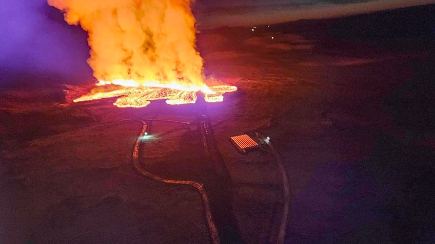 Billowing smoke and flowing lava are seen in this Icelandic Department of Civil Protection and Emergency Management , January 14, 2024, handout image during an volcanic eruption on the outskirts of the evacuated town of Grindavik, western Iceland. Seismic activity had intensified overnight and residents of Grindavik were evacuated, Icelandic public broadcaster RUV reported. This is Iceland's fifth volcanic eruption in two years, the previous one occurring on December 18, 2023 in the same region southwest of the capital Reykjavik. Iceland is home to 33 active volcano systems, the highest number in Europe. (Photo by Icelandic Department of Civil Protection and Emergency Management / AFP) (Photo by ICELANDIC DEPARTMENT OF CIVIL PROTECTION AND EMERGENCY MANAGEMENT/AFP via Getty Images)