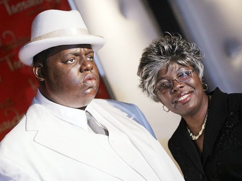 Voletta Wallace poses for a photo with a wax figure of her son Christopher 'Biggie Smalls'
