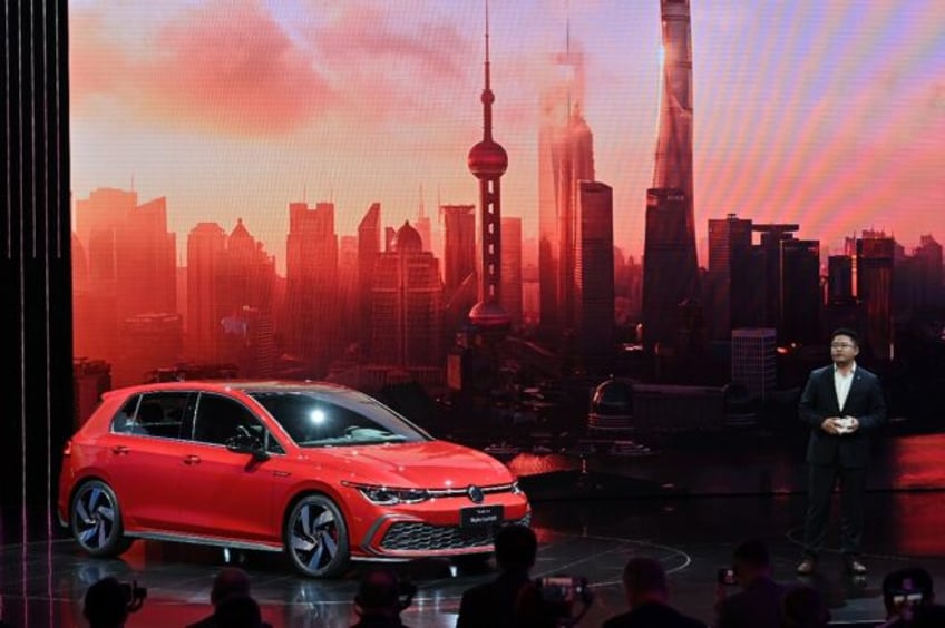 volkswagen profits dip as it struggles in china