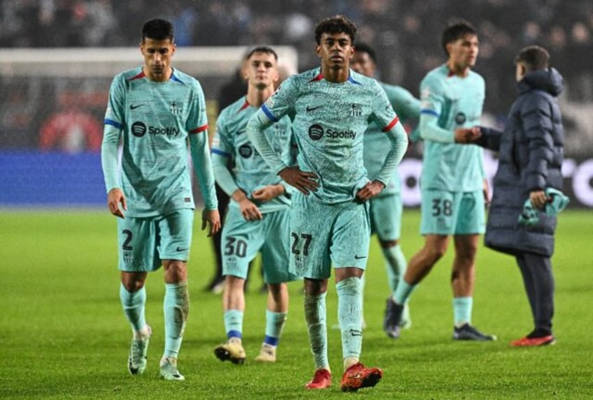 A disconsolate Barcelona side leave the pitch after Wednesday's Champions League defeat to Antwerp cranked up the criticism