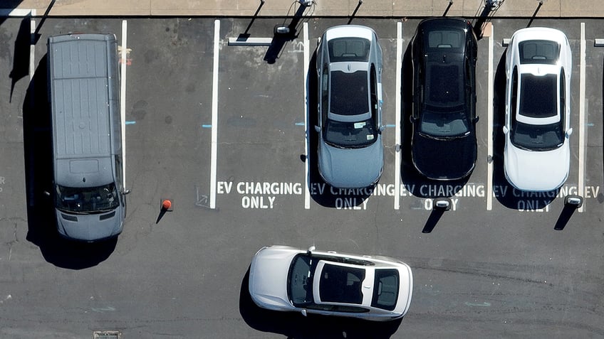 Overhead view of lot with spaces marked EV charging only