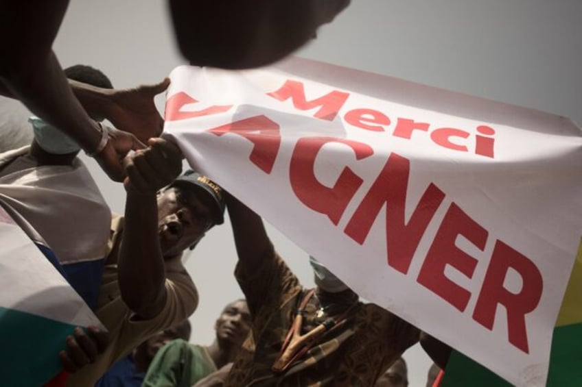 Demonstrators wave a banner that reads "Thank you Wagner" during a rally in Bamako on Febr
