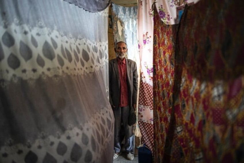 Wolde Meressa, 78, lives in a school classroom at an IDP camp in Mekele