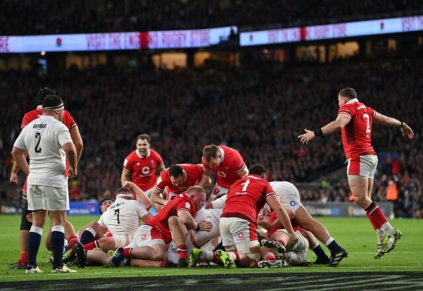 A young Wales team competed hard against England at Twickenham before losing 16-14