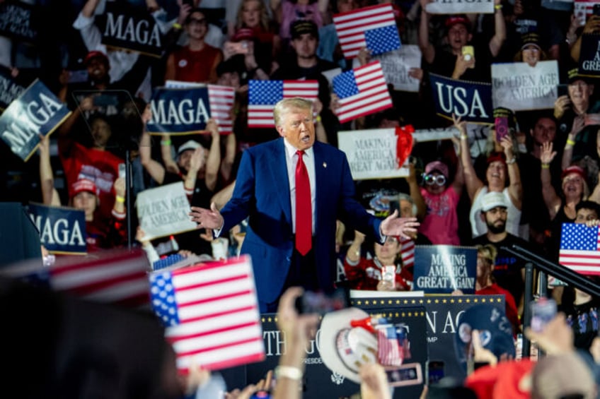 US President Donald Trump arrives for a 100th day rally in Warren, Michigan, US, on Tuesda