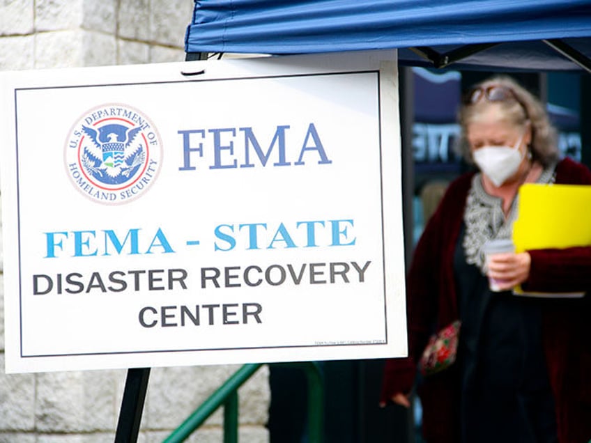 People gather at a FEMA Disaster Recovery Center at A.C. Reynolds High School in Asheville