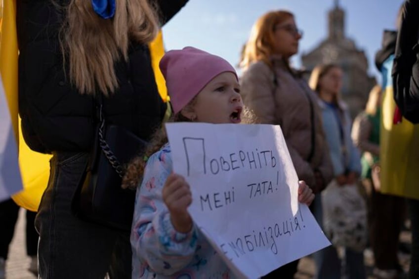 war weary mothers wives and children of ukrainian soldiers demand a cap on military service time