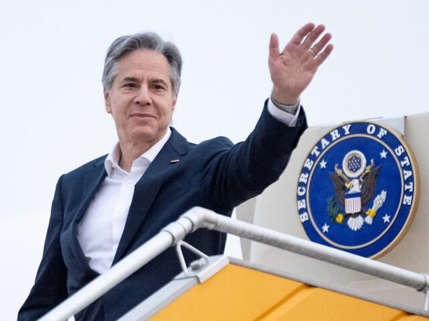 US Secretary of State Antony Blinken waves as he boards his plane at Hanoi Airport in Hanoi on April 16, 2023, to travel to Japan for the G7 Foreign Ministers' Meeting. (Photo by Andrew Harnik / POOL / AFP) (Photo by ANDREW HARNIK/POOL/AFP via Getty Images)